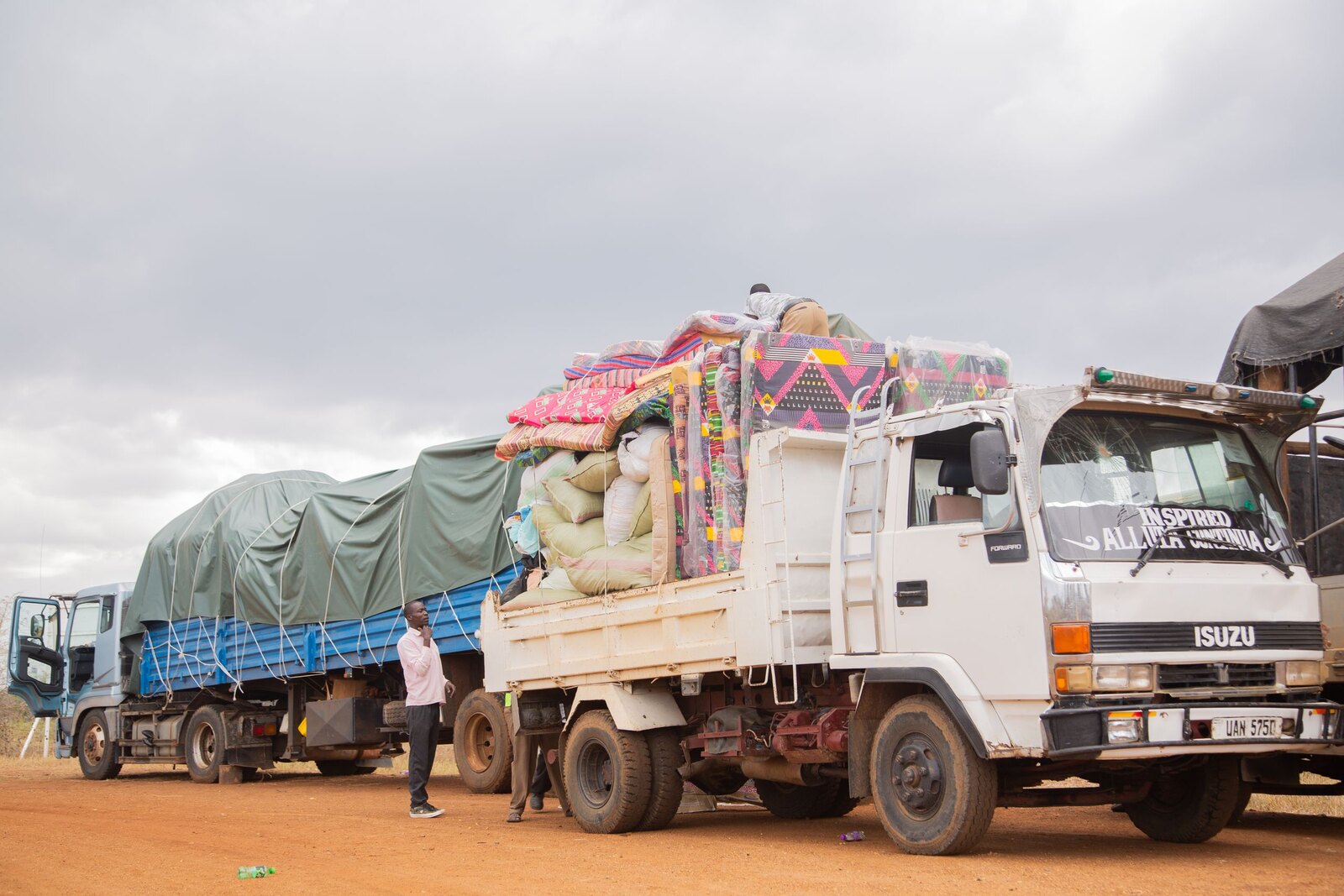 Loaded freight trucks lined up on a depot yard